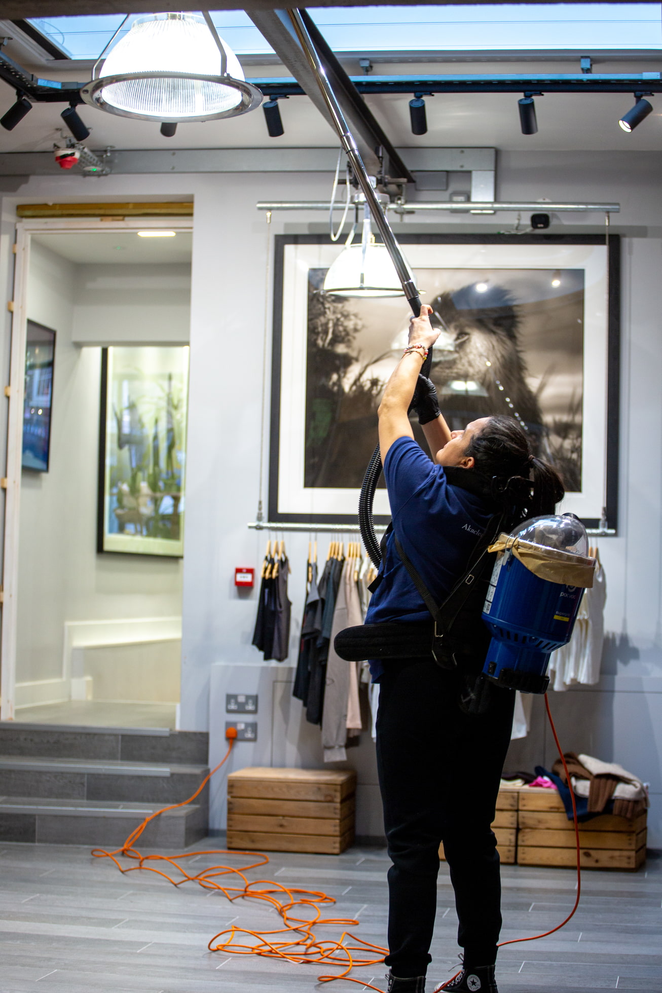 Office cleaning London team carrying out high-level dusting